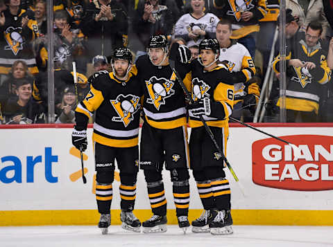 PITTSBURGH, PA – DECEMBER 30: Pittsburgh Penguins Center Evgeni Malkin (71) celebrates his goal with Pittsburgh Penguins Right Wing Bryan Rust (17) and Pittsburgh Penguins Defenseman John Marino (6) during the second period in the NHL game between the Pittsburgh Penguins and the Ottawa Senators on December 30, 2019, at PPG Paints Arena in Pittsburgh, PA. (Photo by Jeanine Leech/Icon Sportswire via Getty Images)