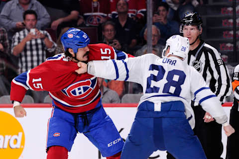 George Parros of the Montreal Canadiens fights Colton Orr of the Toronto Maple Leafs in 2013 (Photo by Richard Wolowicz/Getty Images)