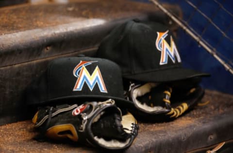 MIAMI, FL – JULY 29: Miami Marlins hats and gloves sit on the dugout steps during the game against the Washington Nationals at Marlins Park on July 29, 2014 in Miami, Florida. (Photo by Rob Foldy/Getty Images)