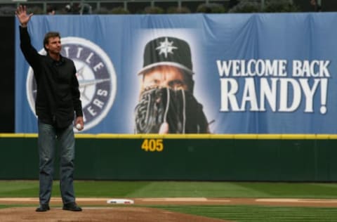 SEATTLE – APRIL 12: Former Mariners star Randy Johnson waves to the crowd prior to throwing out the ceremonial first pitch before the Mariners’ home opener against the Oakland Athletics at Safeco Field on April 12, 2010 in Seattle, Washington. (Photo by Otto Greule Jr/Getty Images)