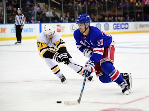 NEW YORK, NEW YORK – NOVEMBER 12: Chris Kreider #20 of the New York Rangers controls the puck with pressure from Evgeni Malkin #71 of the Pittsburgh Penguins during their game at Madison Square Garden on November 12, 2019 in New York City. (Photo by Emilee Chinn/Getty Images)