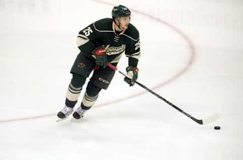 Apr 24, 2016; Saint Paul, MN, USA; Minnesota Wild defenseman Jonas Brodin (25) carries the puck up ice during the third period Minnesota Wild Dallas Stars in game six of the first round of the 2016 Stanley Cup Playoffs at Xcel Energy Center. The Stars win 5-4 over the Wild. Mandatory Credit: Marilyn Indahl-USA TODAY Sports