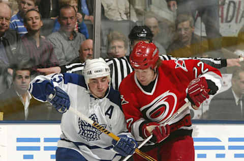 TORONTO – MARCH 27: Mike Commodore #22 of the Carolina Hurricanes battles for the puck with Tomas Kaberle #15 of the Toronto Maple Leafs during their NHL game at the Air Canada Centre on March 27, 2007, in Toronto, Ontario. (Photo By Dave Sandford/Getty Images)