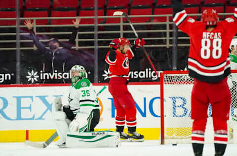 Jan 31, 2021; Raleigh, North Carolina, USA; Carolina Hurricanes right wing Nino Niederreiter (21) scores goal against Dallas Stars goaltender Anton Khudobin (35) at PNC Arena. Mandatory Credit: James Guillory-USA TODAY Sports