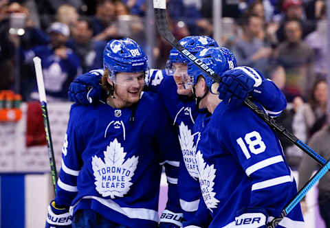 TORONTO, ON – NOVEMBER 30: William Nylander #88 of the Toronto Maple Leafs and teammates Kasperi Kapanen #24 and Andreas Johnsson #18 celebrate after defeating the Buffalo Sabres in overtime at the Scotiabank Arena on November 30, 2019 in Toronto, Ontario, Canada. (Photo by Kevin Sousa/NHLI via Getty Images)