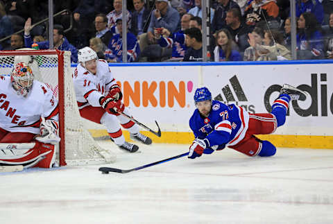 May 24, 2022; New York, New York, USA; New York Rangers center Filip Chytil (72) takes a shot while diving around the side of the net against the Carolina Hurricanes during the third period in game four of the second round of the 2022 Stanley Cup Playoffs at Madison Square Garden. Mandatory Credit: Danny Wild-USA TODAY Sports