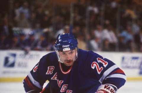 File Picture: 15 Dec 1995: Ray Ferraro #21 of the New York Rangers moves the puck down the ice in the game against the Buffalo Sabres at the Memorial Auditorium in Buffalo, New York. Unconfirmed reports circulated, 14 February 1996, that Ferraro and te