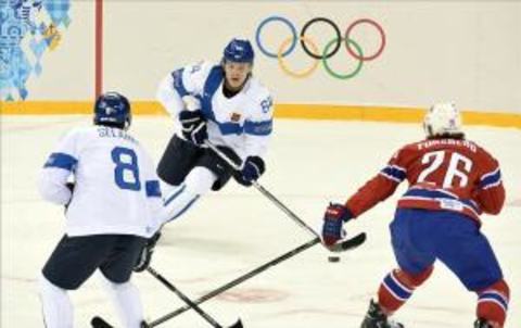 Feb 14, 2014; Sochi, RUSSIA; Finland forward Mikael Granlund (64) controls the puck against Norway in a men’s preliminary round ice hockey game during the Sochi 2014 Olympic Winter Games at Shayba Arena. Mandatory Credit: Richard Mackson-USA TODAY Sports