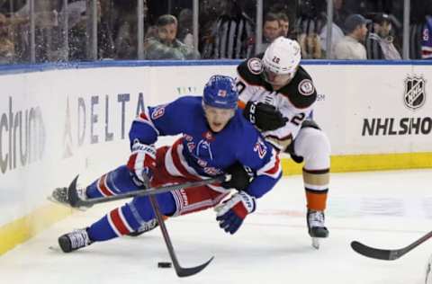 NEW YORK, NEW YORK – OCTOBER 17: Brett Leason #20 of the Anaheim Ducks trips up Dryden Hunt #29 of the New York Rangers during the first period at Madison Square Garden on October 17, 2022, in New York City. (Photo by Bruce Bennett/Getty Images)