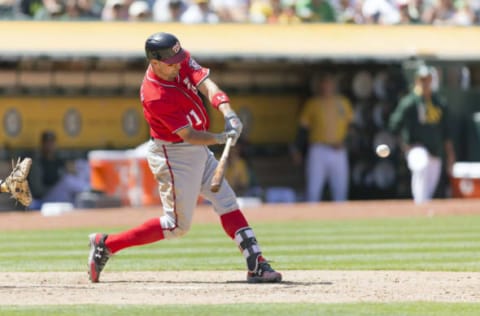 Jun 4, 2017; Oakland, CA, USA; Washington Nationals designated hitter Ryan Zimmerman (11) hits a three run home run during the eighth inning against the Oakland Athletics at Oakland Coliseum. Mandatory Credit: Neville E. Guard-USA TODAY Sports