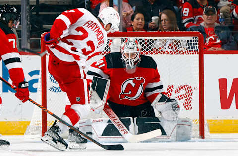 Vitek Vanecek stops Lucas Raymond in tight in the Devils’ home opener. (Photo by Bruce Bennett/Getty Images)