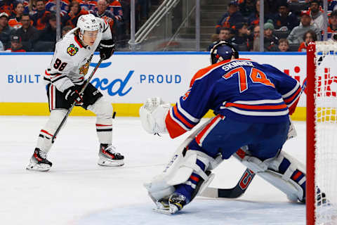 Dec 12, 2023; Edmonton, Alberta, CAN; Chicago Blackhawks forward Connor Bedard (98) tries to get a shot away on Edmonton Oilers goaltender Stuart Skinner (74) during the second period at Rogers Place. Mandatory Credit: Perry Nelson-USA TODAY Sports