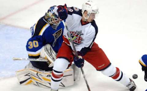 Mar 27, 2007; St. Louis, MO, USA; Columbus Blue Jackets forward Alexandre Picard (19) attempts to screen St. Louis Blues goalie Jason Bacashihua (30) during the second period at the Scottrade Center in St. Louis, MO. The Blue Jackets defeated the blues 4-1. Mandatory Credit:Scott Rovak-USA TODAY Sports Copyright © Scott Rovak