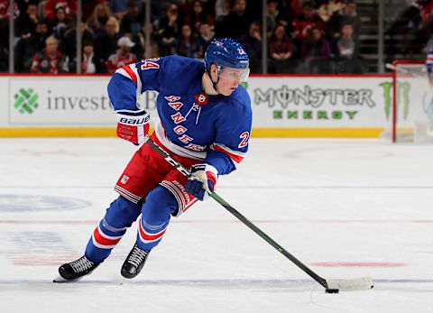 NEWARK, NEW JERSEY – NOVEMBER 30: Kaapo Kakko #24 of the New York Rangers takes the puck in the first period against the New Jersey Devils at Prudential Center on November 30, 2019 in Newark, New Jersey. (Photo by Elsa/Getty Images)