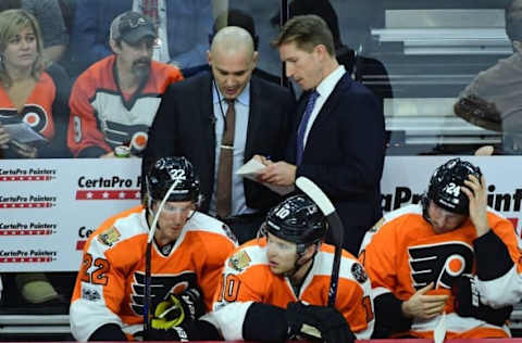 NHL Power Rankings: Philadelphia Flyers assistant coach Ian Laperriere and head coach Dave Hakstol confer with each other against the New York Rangers during the third period at Wells Fargo Center. The Rangers defeated the Flyers, 5-2. Mandatory Credit: Eric Hartline-USA TODAY Sports