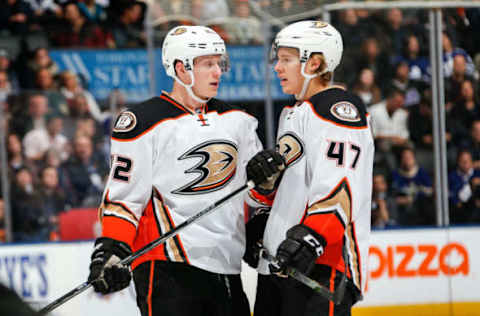 TORONTO, ON – DECEMBER 19: Josh Manson #42 of the Anaheim Ducks speaks to teammate Hampus Lindholm #47 of the Anaheim Ducks during the third period at the Air Canada Centre on December 19, 2016, in Toronto, Ontario, Canada. (Photo by Kevin Sousa/NHLI via Getty Images)