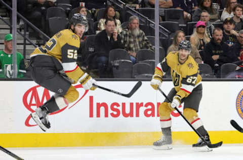 LAS VEGAS, NEVADA – MARCH 06: Dylan Coghlan #52 of the Vegas Golden Knights jumps out of the way of a shot by teammate Max Pacioretty #67 against the Ottawa Senators in the second period of their game at T-Mobile Arena on March 06, 2022 in Las Vegas, Nevada. (Photo by Ethan Miller/Getty Images)