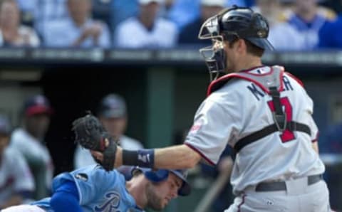 Kansas City Royals’ Mike Moustakas (8) is tagged out at the plate by Minnesota Twins catcher Joe Mauer (7) in the fourth inning during Wednesday’s baseball game at Kauffman Stadium on September 14, 2011, in Kansas City, Missouri. (John Sleezer/Kansas City Star/MCT via Getty Images)