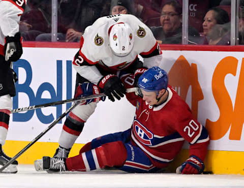 Oct 4, 2022; Montreal, Quebec, CAN; Ottawa Senators defenseman Artem Zub (2) pushes Montreal Canadiens forward Juraj Slafkovsky (20) during the first period at the Bell Centre. Mandatory Credit: Eric Bolte-USA TODAY Sports