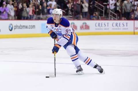 NHL Power Rankings: Edmonton Oilers center Connor McDavid (97) carries the puck during a shootout against the Arizona Coyotes at Gila River Arena. Mandatory Credit: Matt Kartozian-USA TODAY Sports