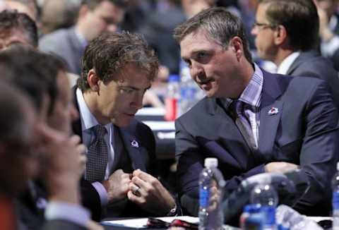 Jun 30, 2013; Newark, NJ, USA; Colorado Avalanche head coach Patrick Roy (right) talks with executive of hockey operations Joe Sakic (left) during the 2013 NHL Draft at the Prudential Center. Mandatory Credit: Ed Mulholland-USA TODAY Sports