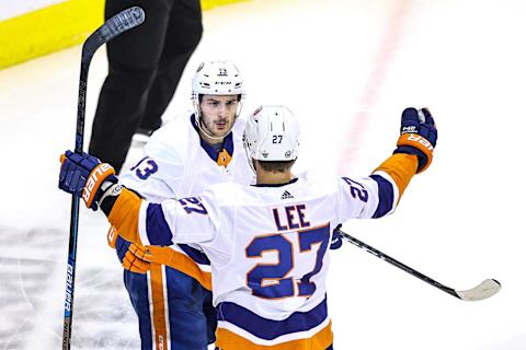 Anders Lee #27, Mathew Barzal #13 of the New York Islanders. (Photo by Elsa/Getty Images)