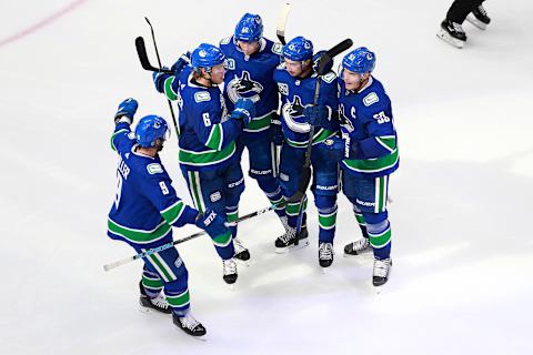 EDMONTON, ALBERTA – AUGUST 04: Bo Horvat #53 of the Vancouver Canucks celebrates his third period goal with Quinn Hughes #43, Elias Pettersson #40 and Brock Boeser #6. (Photo by Jeff Vinnick/Getty Images)