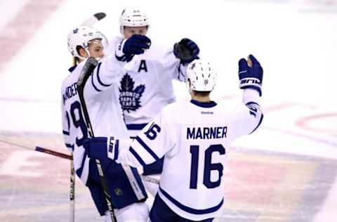 Dec 28, 2016; Sunrise, FL, USA; Toronto Maple Leafs center Mitch Marner (16) celebrates his game winning goal with right wing William Nylander (29) and defenseman Morgan Rielly in a shoot out against the Florida Panthers at BB&T Center. The Maple Leafs won 3-2. Mandatory Credit: Robert Mayer-USA TODAY Sports