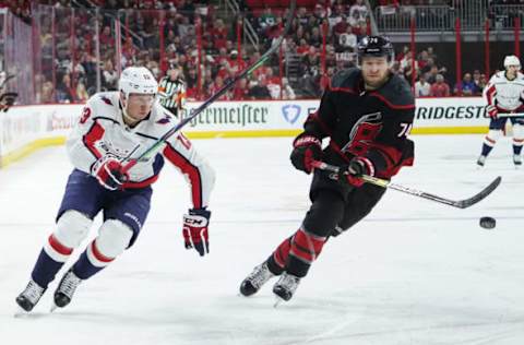 RALEIGH, NC – APRIL 18: Carolina Hurricanes defenseman Jaccob Slavin (74) and Washington Capitals left wing Jakub Vrana (13) chase after a puck during a game between the Carolina Hurricanes and the Washington Capitals on April 18, 2019, at the PNC Arena in Raleigh, NC. (Photo by Greg Thompson/Icon Sportswire via Getty Images)