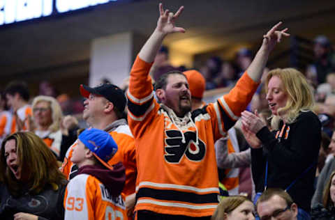 Mar 24, 2016; Denver, CO, USA; Philadelphia Flyers fans celebrate from the stands after the Flyers’ score a goal in the third period against the Colorado Avalanche at the Pepsi Center. The Flyers won 4-2. Mandatory Credit: Ron Chenoy-USA TODAY Sports