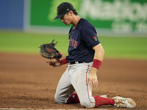 Apr 25, 2022; Toronto, Ontario, CAN; Boston Red Sox first baseman Bobby Dalbec (29) reacts after not being able to make a play on a bunt by Toronto Blue Jays center fielder Bradley Zimmer (not pictured) during the eighth inning at Rogers Centre. Mandatory Credit: John E. Sokolowski-USA TODAY Sports