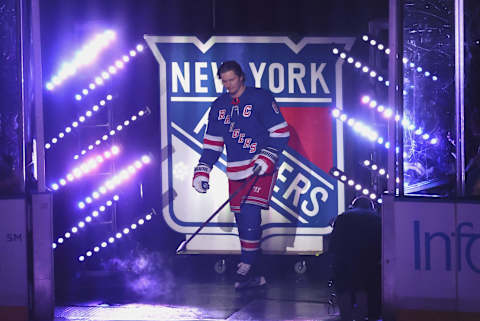 NEW YORK, NEW YORK – OCTOBER 11: Jacob Trouba #8 of the New York Rangers is introduced as the new captain of the New York Rangers prior to the game against the Tampa Bay Lightning at Madison Square Garden during the season-opening game on October 11, 2022, in New York City. (Photo by Bruce Bennett/Getty Images)