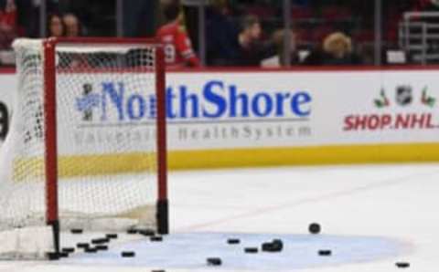 Dec 3, 2017; Chicago, IL, USA; A general view of a hockey net with pucks during warm ups prior to a game between the Los Angeles Kings and the Chicago Blackhawks at the United Center. Mandatory Credit: Patrick Gorski-USA TODAY Sports WEEK TWO