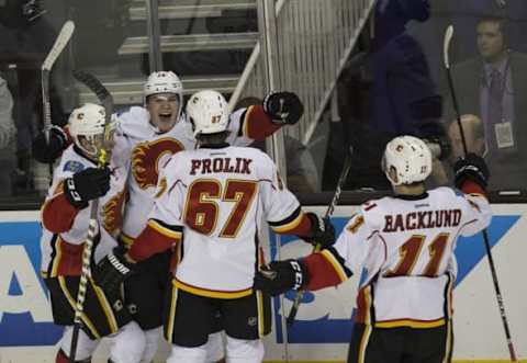 Nov 3, 2016; San Jose, CA, USA; Calgary Flames left wing Matthew Tkachuk (19) celebrates with right wing Michael Frolik (67) and center Mikael Backlund (11) after scoring a goal during the third period against the San Jose Sharks at SAP Center at San Jose the Calgary Flames defeated the San Jose Sharks 3 to 2. Mandatory Credit: Neville E. Guard-USA TODAY Sports