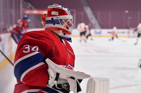 MONTREAL, QC – DECEMBER 16: Goaltender Jake Allen #34 of the Montreal Canadiens kneels as he looks on during the warmups prior to the game against the Philadelphia Flyers at Centre Bell on December 16, 2021 in Montreal, Canada. The Montreal Canadiens defeated the Philadelphia Flyers 3-2 in a shootout. (Photo by Minas Panagiotakis/Getty Images)