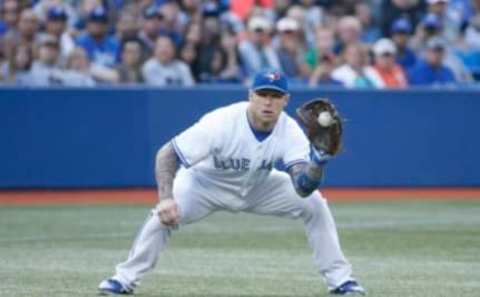 TORONTO, ON – AUGUST 5 – Toronto’s Brett Lawrie fields a ball and steps on the bag at third for the final out of the 1st inning as the Toronto Blue Jays take on the Baltimore Orioles at Rogers Centre on August 5, 2014. (Carlos Osorio/Toronto Star via Getty Images)