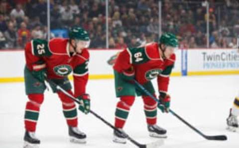 Nov 17, 2016; Saint Paul, MN, USA; Minnesota Wild defenseman Jonas Brodin (25) and forward Mikael Granlund (64) wait for the faceoff in the first period against the Boston Bruins at Xcel Energy Center. Mandatory Credit: Brad Rempel-USA TODAY Sports