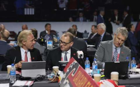 MONTREAL, QUEBEC – JULY 08: (L-R) Don Maloney, Brad Treliving and Tod Button of the Calgary Flames attend the 2022 NHL Draft at the Bell Centre on July 08, 2022 in Montreal, Quebec. (Photo by Bruce Bennett/Getty Images)