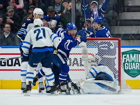 Toronto Maple Leafs, William Nylander (88), Winnipeg Jets, Eric Comrie (1). Mandatory Credit: John E. Sokolowski-USA TODAY Sports