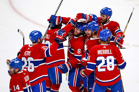 The Montreal Canadiens celebrate the game-winning overtime goal. (Photo by Vaughn Ridley/Getty Images)