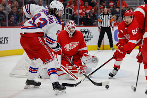 Mar 30, 2022; Detroit, Michigan, USA; New York Rangers center Mika Zibanejad (93) tries to score on Detroit Red Wings goaltender Alex Nedeljkovic (39) in the first period at Little Caesars Arena. Mandatory Credit: Rick Osentoski-USA TODAY Sports