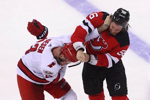 May 7, 2023; Newark, New Jersey, USA; Carolina Hurricanes right wing Stefan Noesen (23) and New Jersey Devils left wing Erik Haula (56) fight Mandatory Credit: Ed Mulholland-USA TODAY Sports