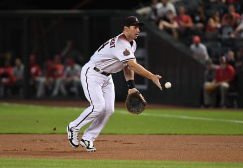 PHOENIX, AZ – AUGUST 06: Paul Goldschmidt #44 of the Arizona Diamondbacks makes an underhand toss to first base against the Philadelphia Phillies at Chase Field on August 6, 2018 in Phoenix, Arizona. (Photo by Norm Hall/Getty Images)