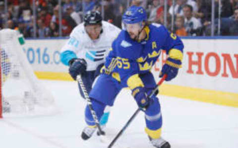 Sep 25, 2016; Toronto, Ontario, Canada; Team Sweden defenceman Erik Karlsson (65) carries the puck past Team Europe forward Marian Hossa (81) during the third period of a semifinal game in the 2016 World Cup of Hockey at Air Canada Centre. Mandatory Credit: John E. Sokolowski-USA TODAY Sports