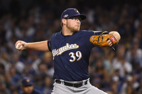 LOS ANGELES, CA – OCTOBER 16: Corbin Burrnes #39 of the Milwaukee Brewers delivers a pitch in the sixth inning against the Los Angeles Dodgers in Game Four of the National League Championship Series at Dodger Stadium on October 16, 2018 in Los Angeles, California. (Photo by Harry How/Getty Images)