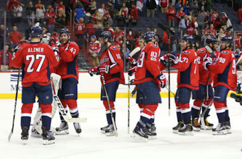 NHL Power Rankings: Washington Capitals players celebrate after their game against the Carolina Hurricanes at Verizon Center. The Capitals won 5-0. Mandatory Credit: Geoff Burke-USA TODAY Sports