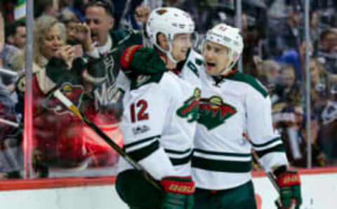 Apr 6, 2017; Denver, CO, USA; Minnesota Wild right wing Nino Niederreiter (22) celebrates his goal with center Eric Staal (12) in the third period against the Colorado Avalanche at the Pepsi Center. The Wild won 4-3. Mandatory Credit: Isaiah J. Downing-USA TODAY Sports