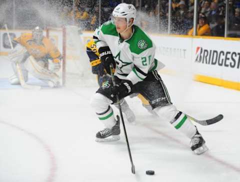 Feb 15, 2016; Nashville, TN, USA; Dallas Stars center Cody Eakin (20) looks to pass the puck during the second period against the Nashville Predators at Bridgestone Arena. Mandatory Credit: Christopher Hanewinckel-USA TODAY Sports