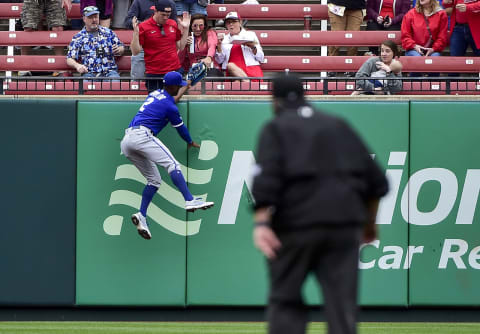 May 2, 2022; St. Louis, Missouri, USA; Kansas City Royals center fielder Michael A. Taylor (2) climbs the wall and robs St. Louis Cardinals catcher Andrew Knizner (not pictured) of a home run during the fifth inning at Busch Stadium. Mandatory Credit: Jeff Curry-USA TODAY Sports