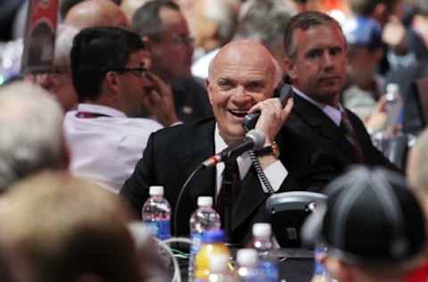 Jun 30, 2013; Newark, NJ, USA; New Jersey Devils general manager Lou Lamoriello speaks on the phone during the 2013 NHL Draft at the Prudential Center. Mandatory Credit: Ed Mulholland-USA TODAY Sports